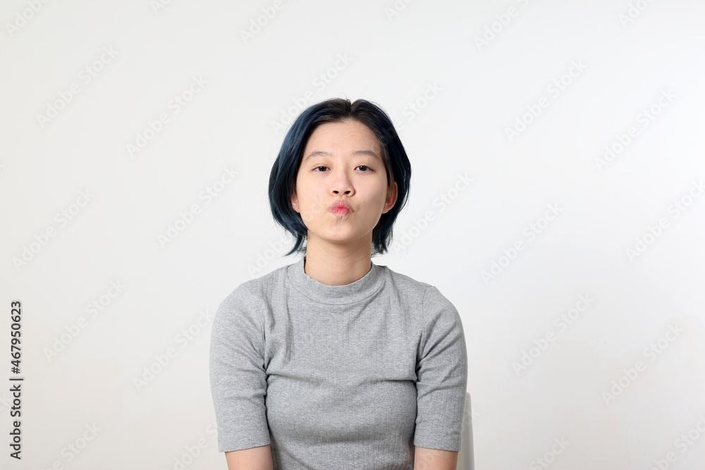 Young attractive Asian chinese malay woman pose face body expression mode emotion on white background kiss Young attractive Asian chinese malay woman pose face body expression mode emotion on white background kiss