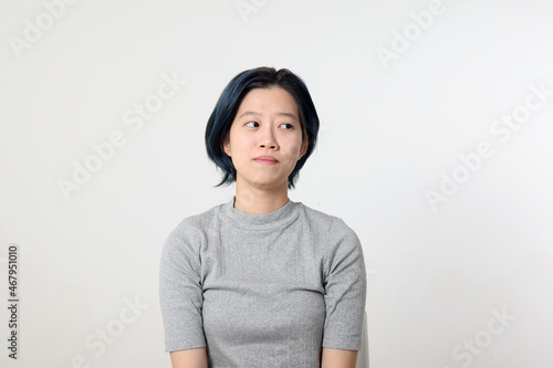 Young attractive Asian chinese malay woman pose face body expression mode emotion on white background look side