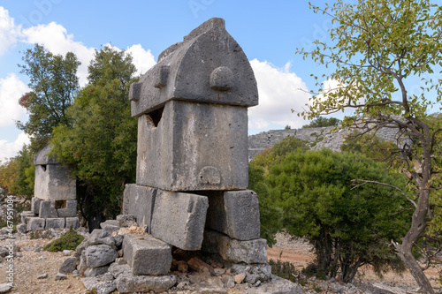 Lycian sarcophagus tombs in acient city Kyaneai. photo