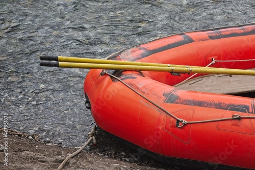 Detail of a orange rubber raft with ore used for river rafting.
