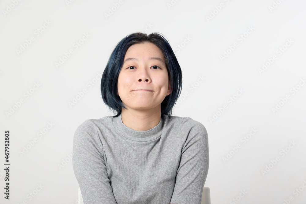 Young attractive Asian chinese malay woman pose face body expression mode emotion on white background smiley lips tucked in