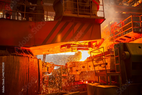 steelworker at work pouring metal in the workshop  Steelmaking workshop