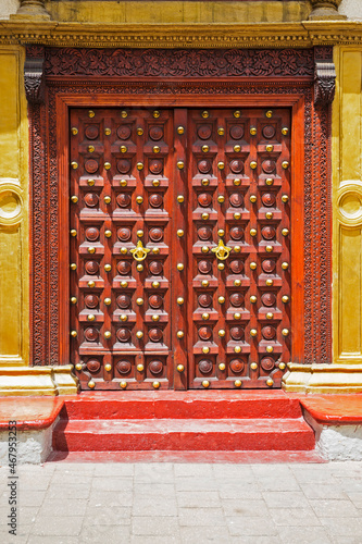Decorated wooden door on building in Stone Town, Zanzibar