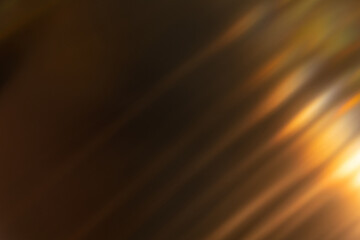 Blur light overlay. Lens flare rays. Defocused glare. Old film flash leak. Bokeh golden orange color beam design glow on dark black abstract background.