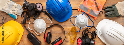Work health and safety flat lay. Labor personal protective gear for industry and construction site. photo