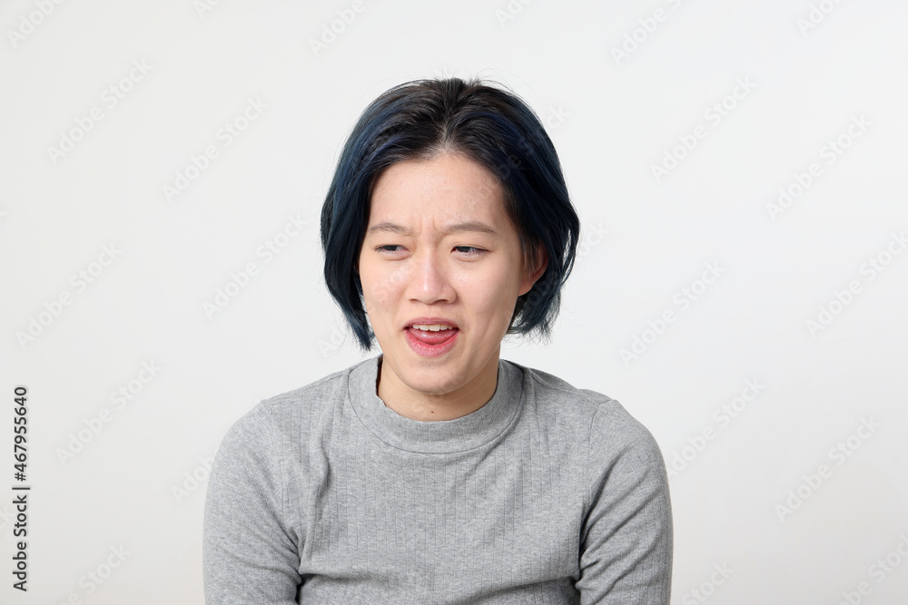 Young attractive Asian chinese malay woman pose face body expression mode emotion on white background disgusting Young attractive Asian chinese malay woman pose face body expression mode emotion on white background disgusting