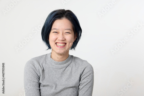 Young attractive Asian chinese malay woman pose face body expression mode emotion on white background laugh smile happy