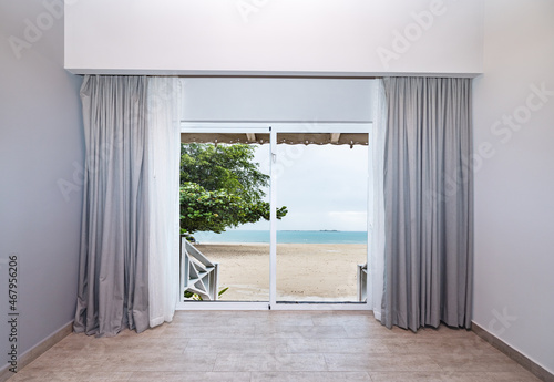 large glass door overlooking the beach