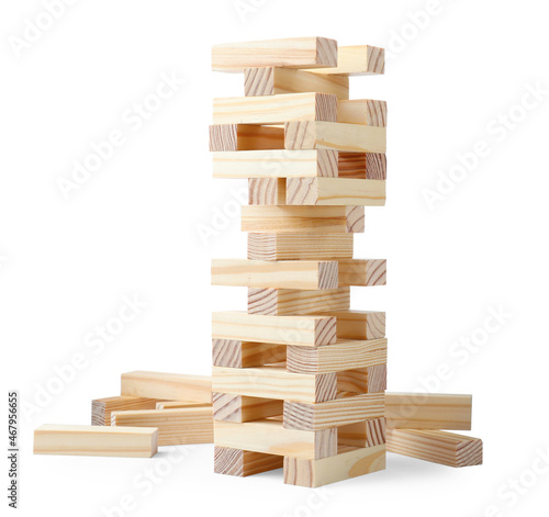 Jenga tower made of wooden blocks on white background photo