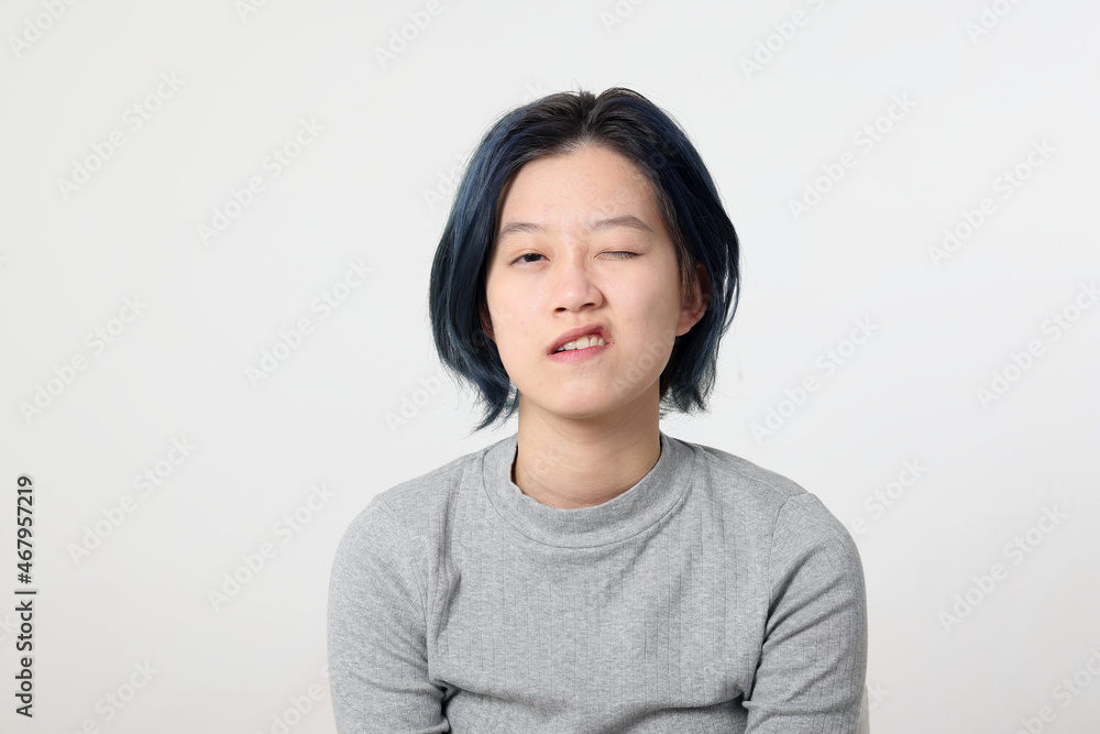 Young attractive Asian chinese malay woman pose face body expression mode emotion on white background wink Young attractive Asian chinese malay woman pose face body expression mode emotion on white background wink