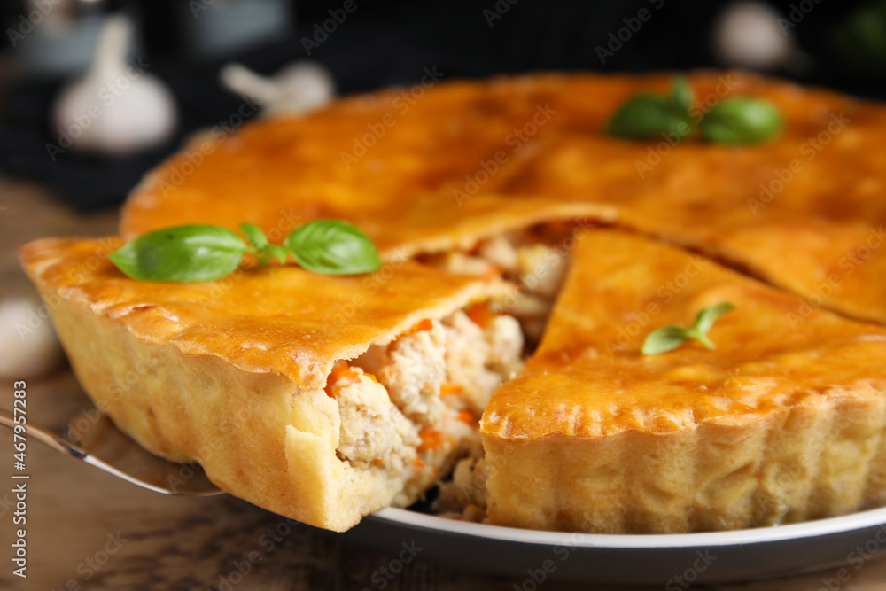 Delicious meat pie with basil on table, closeup Delicious meat pie with basil on table, closeup