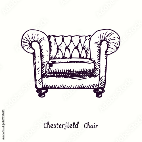 Chesterfield chair. Ink black and white doodle drawing in woodcut style.