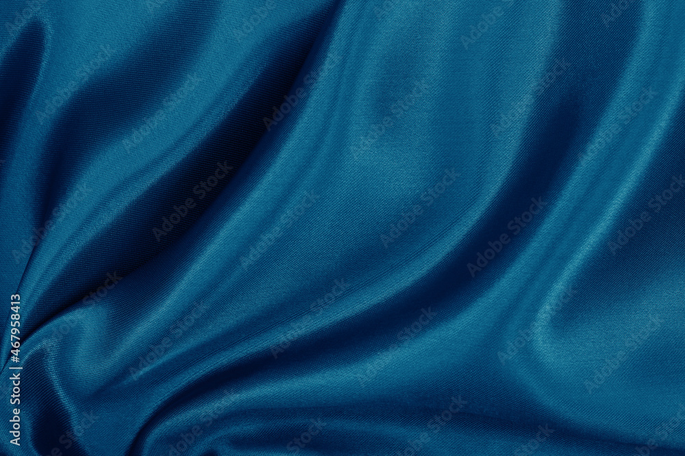 Fototapeta premium Dark blue fabric cloth texture for background and design art work, beautiful crumpled pattern of silk or linen.