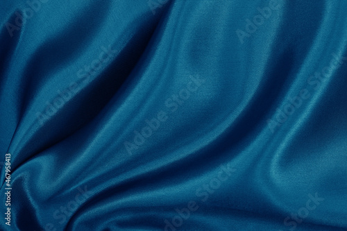 Dark blue fabric cloth texture for background and design art work, beautiful crumpled pattern of silk or linen.