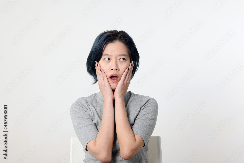 Young attractive Asian chinese malay woman pose face body expression mode emotion on white background and on face surprised shocked Young attractive Asian chinese malay woman pose face body expression mode emotion on white background and on face surprised shocked