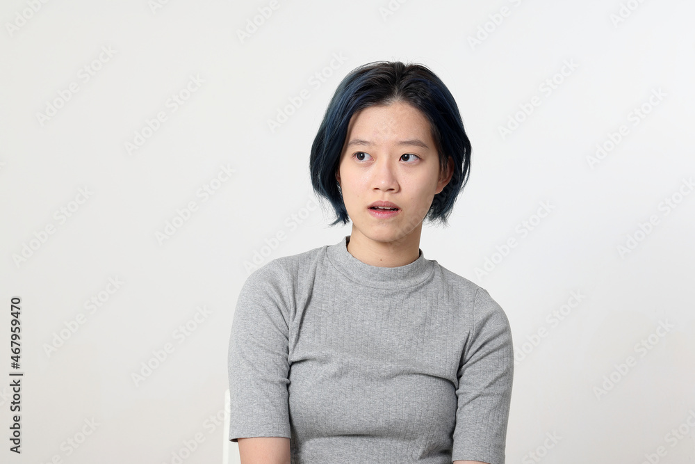 Young attractive Asian chinese malay woman pose face body expression mode emotion on white background look plain Young attractive Asian chinese malay woman pose face body expression mode emotion on white background look plain