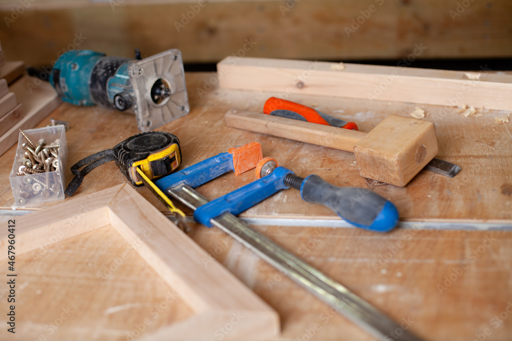 A carpenter in a plaid shirt works a workshop. Wood. Ecological compatibility. Lifestyle. Close up A carpenter in a plaid shirt works a workshop. Wood. Ecological compatibility. Lifestyle. Close up