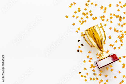 Canvas Print Victory concept with winner golden trophy cup and shiny stars