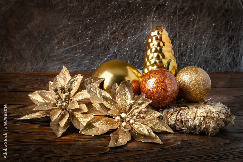 Christmas decorations. New Year's decorations on a dark wooden background. Garlands, balls and toys for Christmas decor. Christmas decorations. New Year's decorations on a dark wooden background. Garlands, balls and toys for Christmas decor.