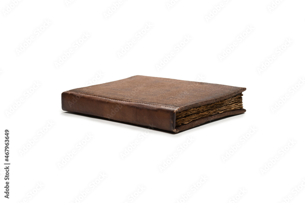 An old brown book isolated on white background. An old brown book isolated on white background.