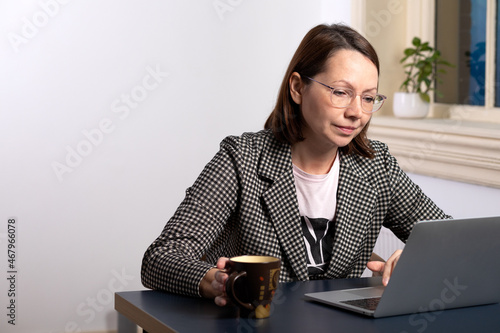 Professional businesswoman working on laptop at the office 