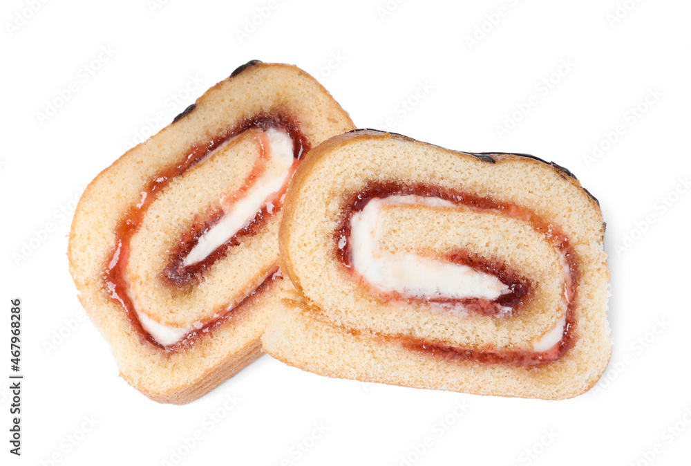 Slices of tasty cake roll with cream and jam on white background, top view Slices of tasty cake roll with cream and jam on white background, top view