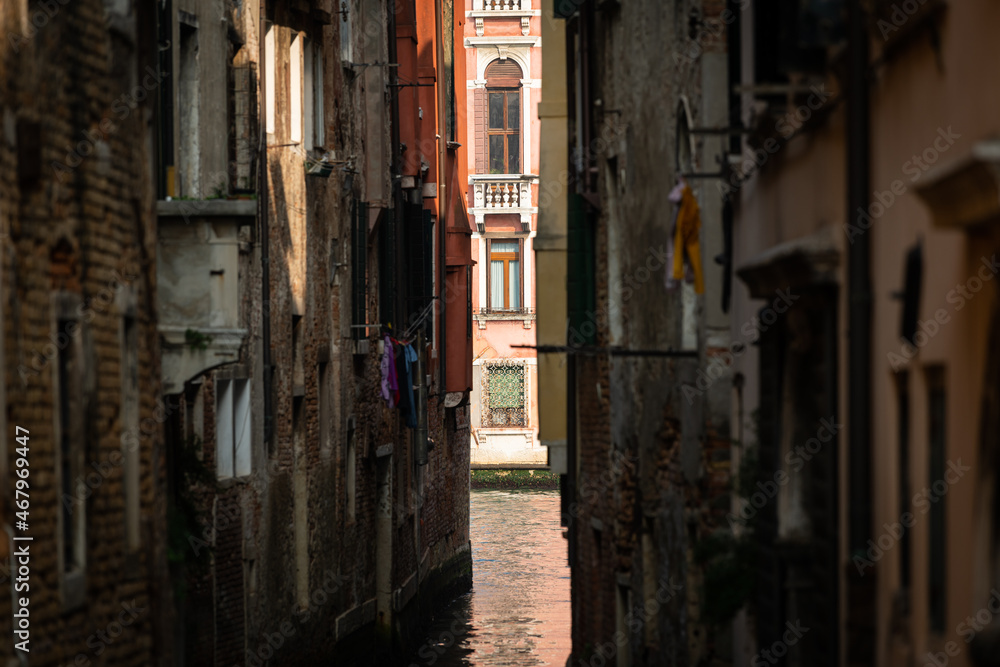 Narrow canal in Venice on a sunny day in autumn