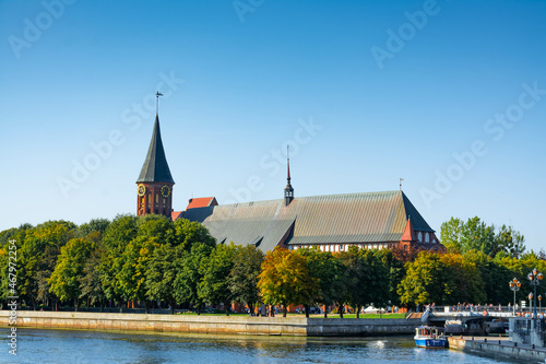 Very colorful view of church in autumn, with trees in different colors