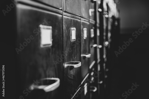 a row of old black filing cabinets 