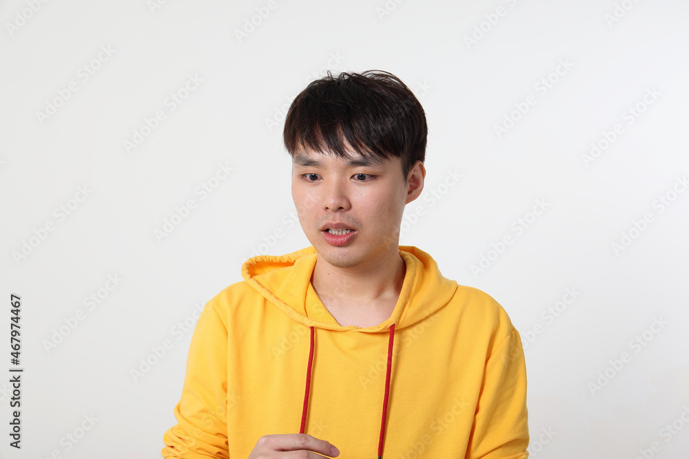 Young good looking Asian chinese malay man pose face body expression mode emotion on white background shocked surprised Young good looking Asian chinese malay man pose face body expression mode emotion on white background shocked surprised