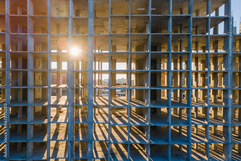Sun shining through the concrete cells on the construction site Sun shining through the concrete cells on the construction site