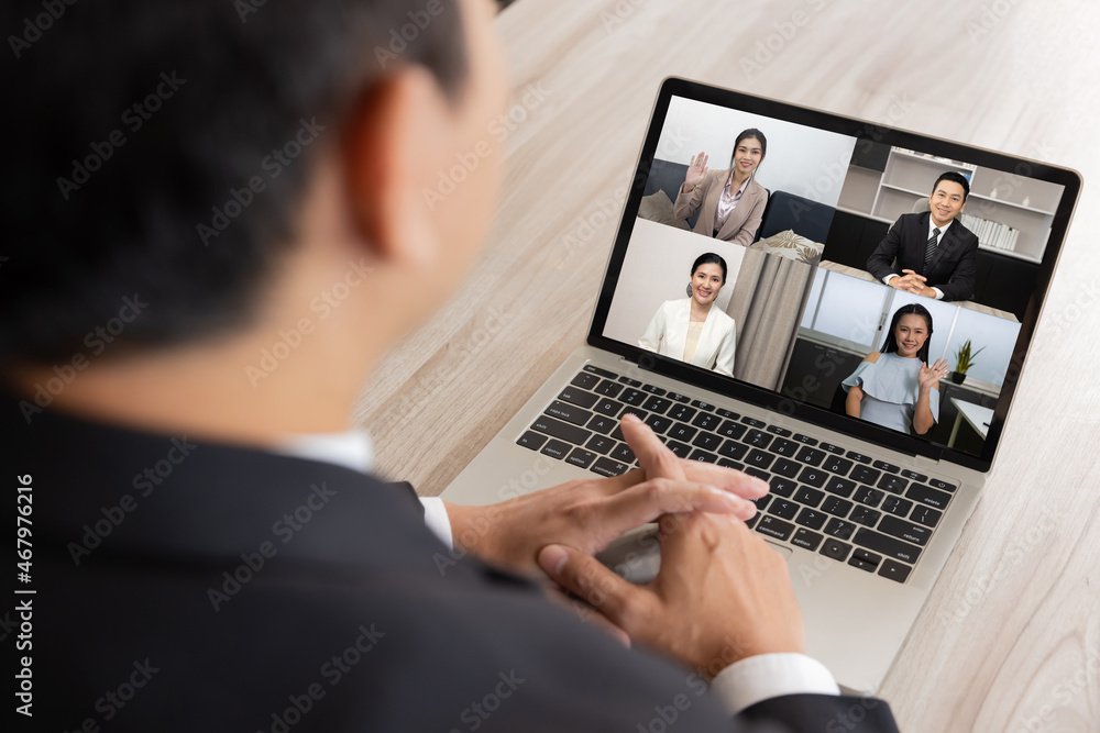 Businessman in a Video Conference Meeting with His Colleagues Businessman in a Video Conference Meeting with His Colleagues