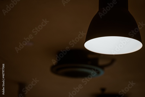 lamp turned on in a dark room