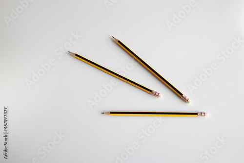 Three pencils on a white background. Top view.
