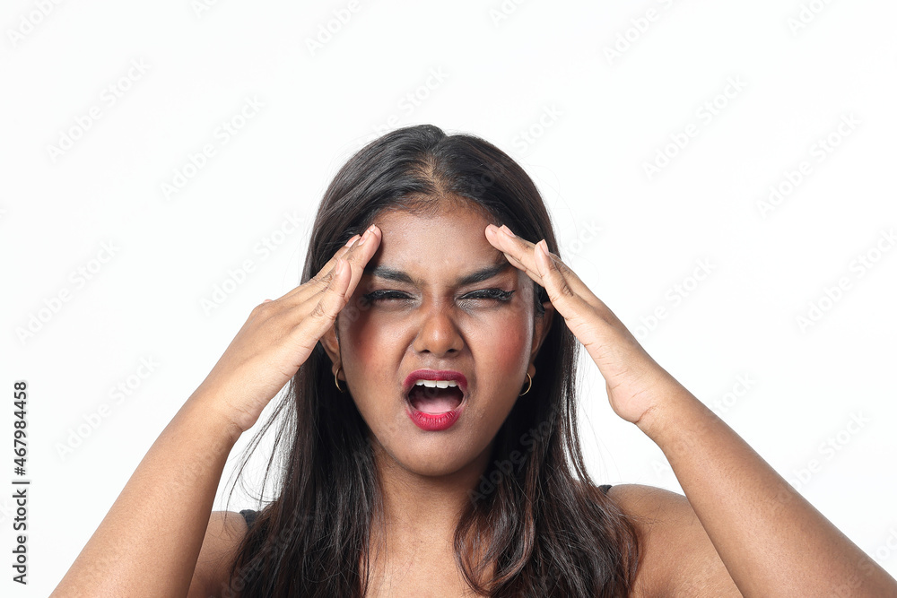 Young attractive Asian Indian woman pose face body expression mode emotion on white background headache hand on forehead Young attractive Asian Indian woman pose face body expression mode emotion on white background headache hand on forehead