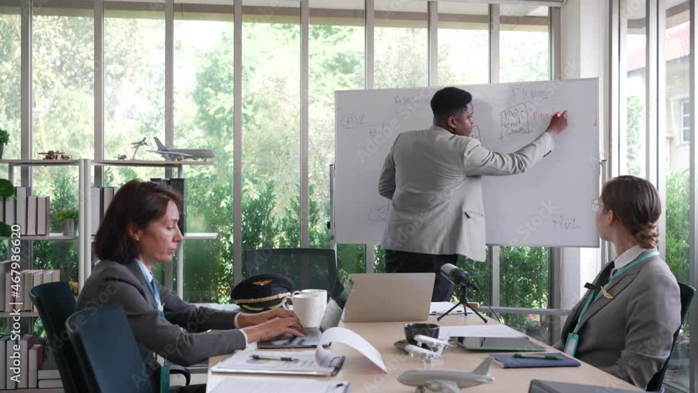 african american manager of airline company trained caucasian flight attendees about business african american manager of airline company trained caucasian flight attendees about business