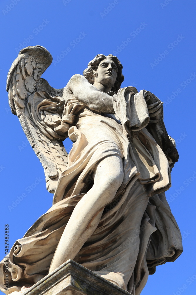 Angel with the Garment and Dice Sculpture on the Ponte Sant'Angelo Bridge in Rome Italy