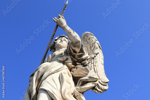 Angel with the Lance Statue Close Up on the Ponte Sant'Angelo Bridge in Rome, Italy photo