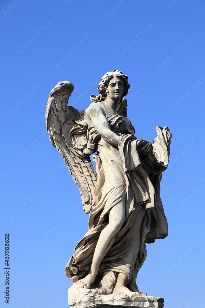 Ponte Sant'Angelo Angel with the Garment and Dice Statue in Rome, Italy