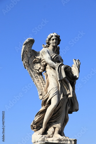 Ponte Sant'Angelo Angel with the Garment and Dice Statue in Rome, Italy