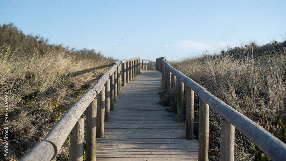 Wooden trail to a beach in Portugal. wooden walkway to the beach. Beach path. Wooden walkways.