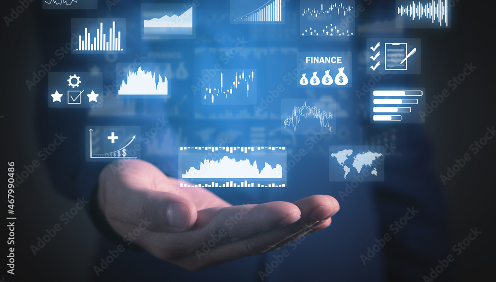 Man holding financial growth graphs. Man holding financial growth graphs.
