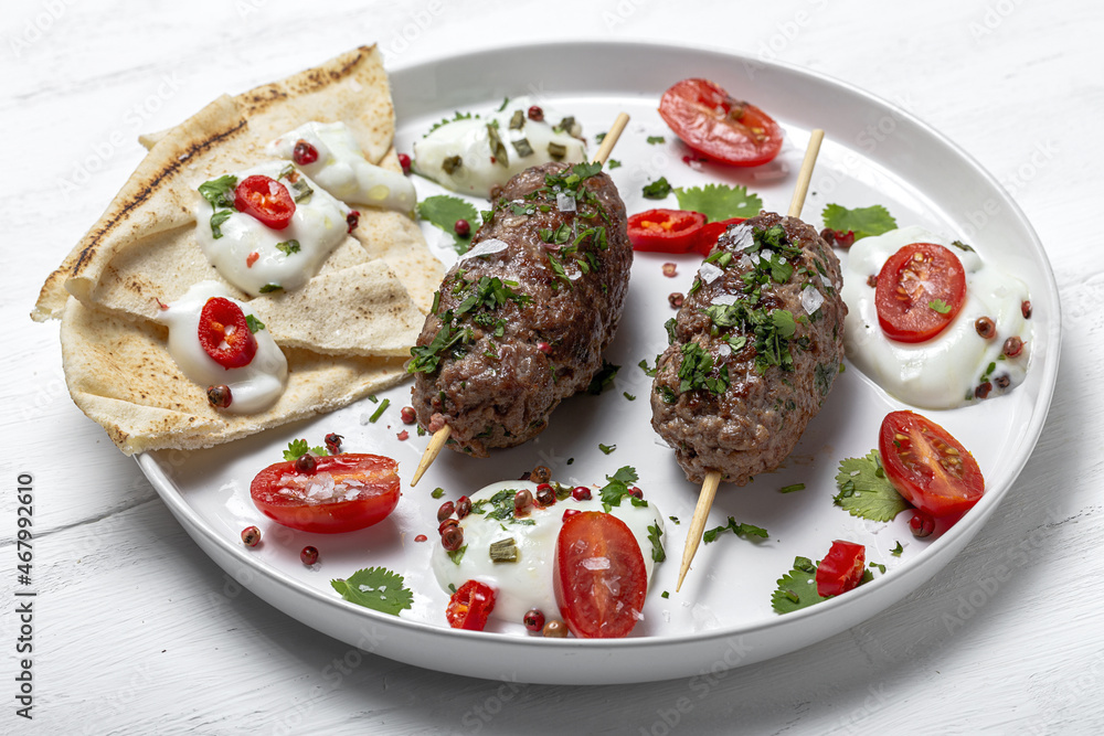Traditional homemade kefta or kebab of meat. Halal concept. Arabic and turkish food Traditional homemade kefta or kebab of meat. Halal concept. Arabic and turkish food