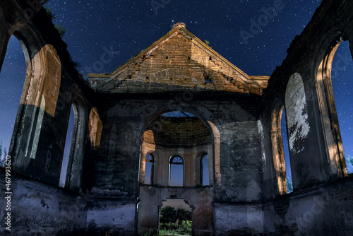 Destroyed building of the Catholic Cathedral at night. A sad sight. Cultural monument photo