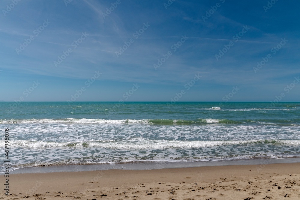 Sea with waves in the foreground on the shoreline