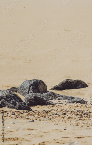 rocks on sandy beach