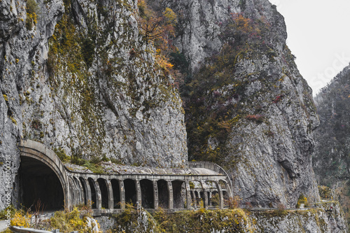 old tunnel on a mountain road photo