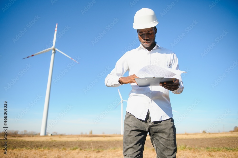 Engineers are investigating the wind turbine. Engineers are investigating the wind turbine.
