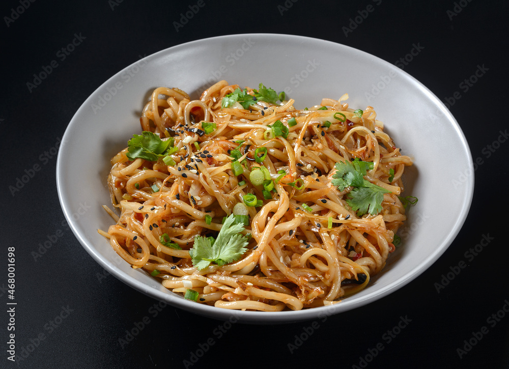 asian noodles on a black background