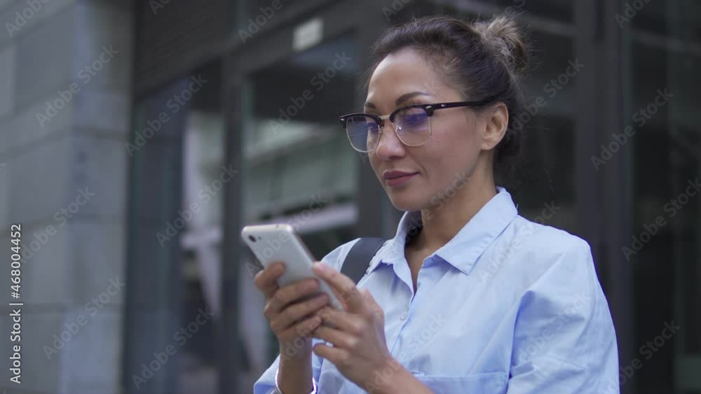 Active business lady sending message from smartphone, communication technology Active business lady sending message from smartphone, communication technology